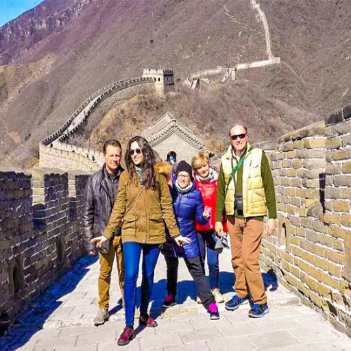 Should I book a private tour or join a group tour in Beijing?