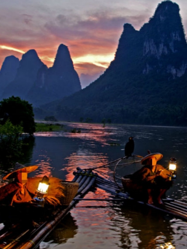 Fisherman on a bamboo raft