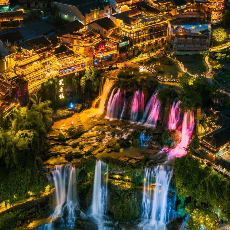 Nightscape of Waterfall & Stilt Houses